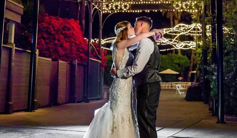 couple kissing at entrance to Zoofari Party Area