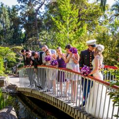 bridal party on a bridge