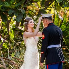 bride fixing grooms cap