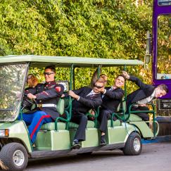 groomsmen clowning on cart